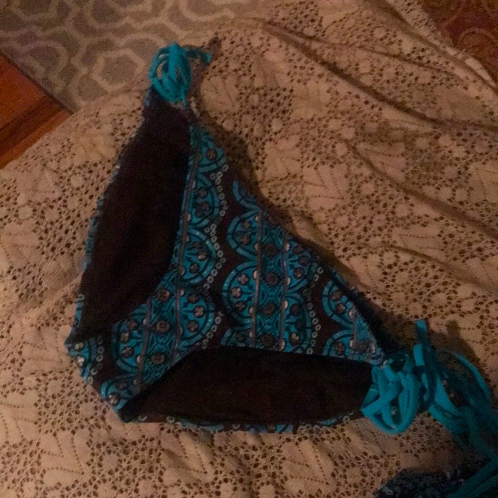 Bikini 👙 size Light blue and brown with little silver shining flowers.